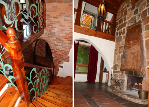 stair way with wrought iron and stone fireplace